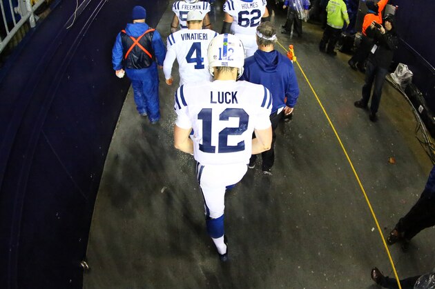 FOXBORO, MA - JANUARY 18:  Andrew Luck #12 of the Indianapolis Colts walks off the field after being defeated by the New England Patriots in the 2015 AFC Championship Game at Gillette Stadium on January 18, 2015 in Foxboro, Massachusetts. The Patriots defeated the Colts 45-7.  (Photo by Al Bello/Getty Images)