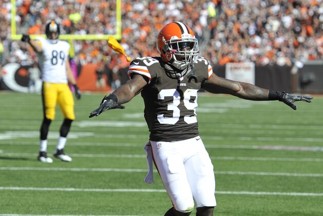 A penalty flag falls near Cleveland Browns free safety Tashaun Gipson (39) during an NFL football game against the Pittsburgh Steelers Sunday, Oct. 12, 2014, in Cleveland. Cleveland won 31-10. (AP Photo/David Richard)