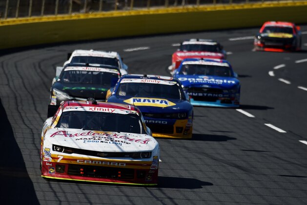 CHARLOTTE, NC - MAY 23:  Regan Smith, driver of the #7 Anderson's Pure Maple Syrup Chevrolet, leads a pack of cars during the NASCAR XFINITY Series Hisense 300 at Charlotte Motor Speedway on May 23, 2015 in Charlotte, North Carolina.  (Photo by Rainier Ehrhardt/Getty Images)