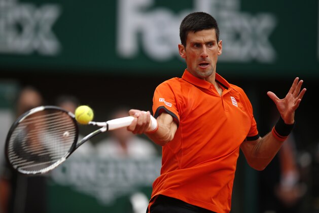 Serbia's Novak Djokovic returns the ball Finland's Jarkko Nieminen during their first round match of the French Open tennis tournament at the Roland Garros stadium, Tuesday, May 26, 2015 in Paris, . (AP Photo/Michel Euler)
