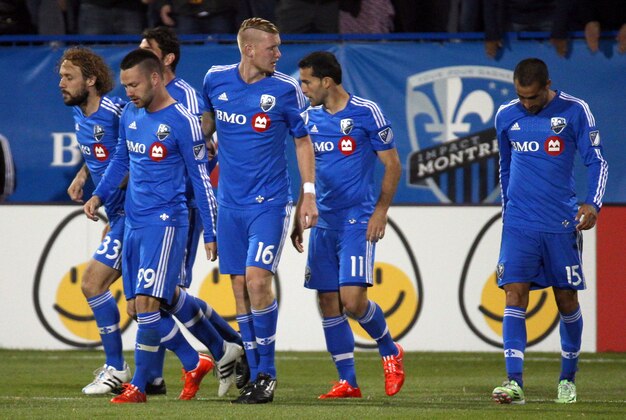May 23, 2015; Montreal, Quebec, CAN; Montreal Impact forward Jack McInerney (99) celebrates his goal against FC Dallas with teammates during the second half at the Stade Saputo. Mandatory Credit: Jean-Yves Ahern-USA TODAY Sport