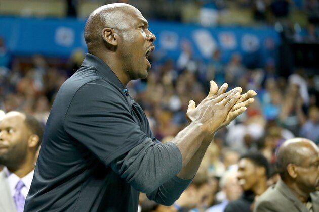 CHARLOTTE, NC - OCTOBER 29:  Michael Jordan, owner of the Charlotte Hornets, watches on during their game against the Milwaukee Bucks at Time Warner Cable Arena on October 29, 2014 in Charlotte, North Carolina.  The Charlotte Hornets defeated the Milwaukee Bucks 108-106 in overtime. NOTE TO USER: User expressly acknowledges and agrees that, by downloading and or using this photograph, User is consenting to the terms and conditions of the Getty Images License Agreement.  (Photo by Streeter Lecka/Getty Images)