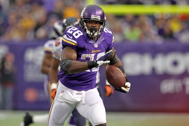 Dec 1, 2013; Minneapolis, MN, USA; Minnesota Vikings running back Adrian Peterson (28) carries the ball during the second quarter against the Chicago Bears at Mall of America Field at H.H.H. Metrodome. Mandatory Credit: Brace Hemmelgarn-USA TODAY Sports