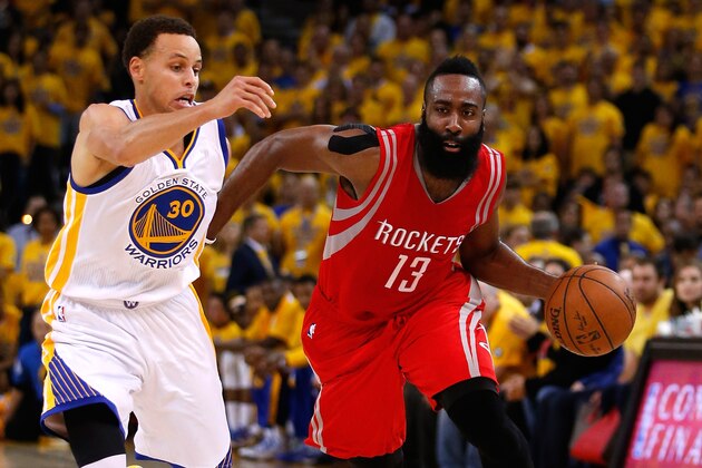 OAKLAND, CA - MAY 21:  James Harden #13 of the Houston Rockets handles the ball against Stephen Curry #30 of the Golden State Warriors in the second quarter during game two of the Western Conference Finals of the 2015 NBA PLayoffs at ORACLE Arena on May 21, 2015 in Oakland, California. NOTE TO USER: User expressly acknowledges and agrees that, by downloading and or using this photograph, user is consenting to the terms and conditions of Getty Images License Agreement.  (Photo by Ezra Shaw/Getty Images)