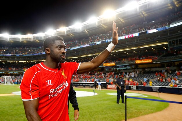 NEW YORK, NY - JULY 30: Kolo Toure #4 of Liverpool waves to the crowd following the game against Manchester City during the International Champions Cup 2014 at Yankee Stadium on July 30, 2014 in the Bronx borough of New York City.  (Photo by Mike Stobe/Getty Images)