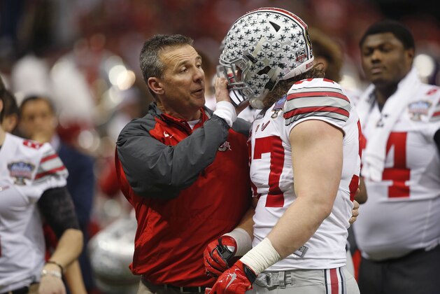 Ohio State defensive lineman Joey Bosa (97)speaks to head coach Urban Meyer in the first half of the Sugar Bowl NCAA college football playoff semifinal game against Alabama, Thursday, Jan. 1, 2015, in New Orleans. (AP Photo/Bill Haber)