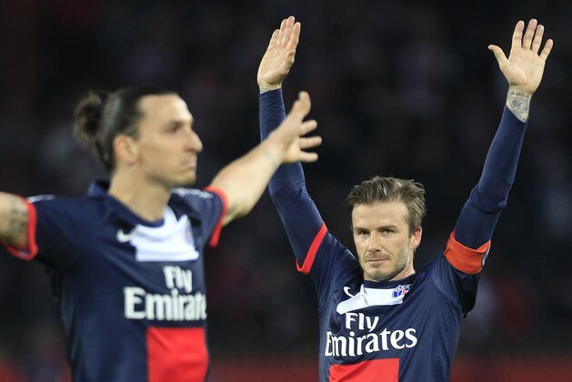 Paris Saint Germain's midfielder David Beckham from England, right, celebrates after Paris Saint Germain's forward Zlatan Ibrahimovic from Sweden, left, scores during their French League One soccer match against Brest, at the Parc des Princes stadium, in Paris, Saturday, May 18, 2013. Paris Saint-Germain hopes to strike a deal with David Beckham in the next two weeks in which the former England captain will work with the French club after retirement, possibly in an ambassadorial role. (AP Photo/Thibault Camus)