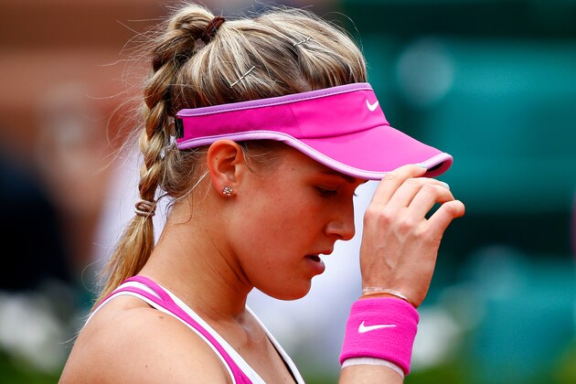 PARIS, FRANCE - MAY 26:  Eugenie Bouchard of Canada reacts during her women's singles match against Kristina Mladenovic of France on day three of the 2015 French Open at Roland Garros on May 26, 2015 in Paris, France.  (Photo by Julian Finney/Getty Images)