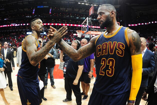 ATLANTA, GA - MAY 20: J.R. Smith #5 high fives LeBron James #23 of the Cleveland Cavaliers after the win for Game One of the Eastern Conference Finals during the NBA Playoffs on May 20, 2015 at Philips Arena in Atlanta, Georgia.  NOTE TO USER: User expressly acknowledges and agrees that, by downloading and or using this Photograph, user is consenting to the terms and conditions of the Getty Images License Agreement.  Mandatory Copyright Notice: Copyright 2015 NBAE (Photo by Scott Cunningham/NBAE via Getty Images)