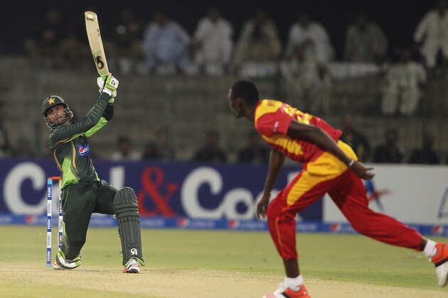 Pakistan's Shoaib Malik hits boundary as Zimbabwe's Christopher Mpofu looks on during a one-day international match at the Gaddafi Stadium in Lahore, Pakistan, Tuesday, May 26, 2015. Malik made an impressive return to limited-overs cricket with a blistering century on Tuesday, propelling Pakistan to 375-3 in the first one-day international against Zimbabwe. (AP Photo/K.M. Chaudary) Pakistan's Shoaib Malik hits boundary as Zimbabwe's Christopher Mpofu looks on during a one-day international match at the Gaddafi Stadium in Lahore, Pakistan, Tuesday, May 26, 2015. Malik made an impressive return to limited-overs cricket with a blistering century on Tuesday, propelling Pakistan to 375-3 in the first one-day international against Zimbabwe. (AP Photo/K.M. Chaudary)