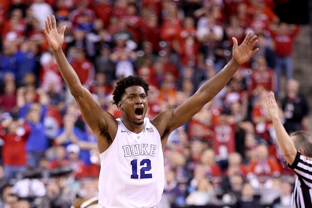 INDIANAPOLIS, IN - APRIL 06: Justise Winslow #12 of the Duke Blue Devils celebrates after defeating the Wisconsin Badgers during the NCAA Men's Final Four National Championship at Lucas Oil Stadium on April 6, 2015 in Indianapolis, Indiana. Duke defeated Wisconsin 68-63. (Photo by Andy Lyons/Getty Images)