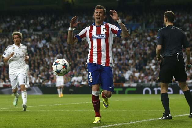 Atletico's Mario Mandzukic reacts during the second leg quarterfinal Champions League soccer match between Real Madrid and Atletico Madrid at Santiago Bernabeu stadium in Madrid, Spain, Wednesday, April 22, 2015. (AP Photo/Andres Kudacki)