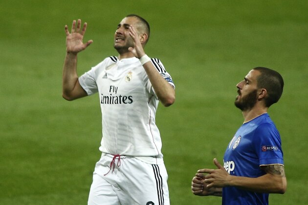 Real Madrid's Karim Benzema reacts during the Champions League second leg semifinal soccer match between Real Madrid and Juventus, at the Santiago Bernabeu stadium in Madrid, Wednesday, May 13, 2015.  (AP Photo/Oscar del Pozo)