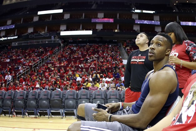 May 25, 2015; Houston, TX, USA; Houston Rockets center Dwight Howard (12) waits with fans in the arena due to emergency flash flooding in the Houston area after the game against the Golden State Warriors in game four of the Western Conference Finals of the NBA Playoffs. at Toyota Center. Mandatory Credit: Troy Taormina-USA TODAY Sports