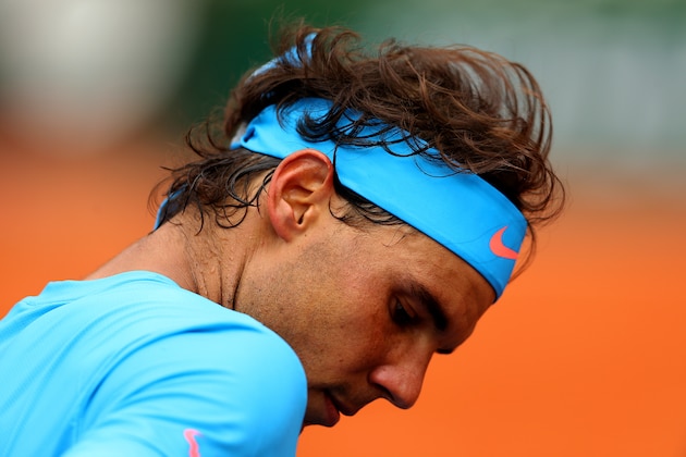 PARIS, FRANCE - MAY 26:   Rafael Nadal of Spain looks on in between play in his Men's Singles match against Quentin Halys of France on day three of the 2015 French Open at Roland Garros on May 26, 2015 in Paris, France.  (Photo by Clive Brunskill/Getty Images)