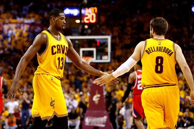 CLEVELAND, OH - MAY 26: Tristan Thompson #13 and Matthew Dellavedova #8 of the Cleveland Cavaliers react after a play in the first quarter against the Atlanta Hawks during Game Four of the Eastern Conference Finals of the 2015 NBA Playoffs at Quicken Loans Arena on May 26, 2015 in Cleveland, Ohio. NOTE TO USER: User expressly acknowledges and agrees that, by downloading and or using this Photograph, user is consenting to the terms and conditions of the Getty Images License Agreement.  (Photo by Gregory Shamus/Getty Images)