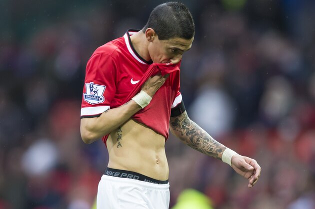 Manchester United's Angel Di Maria walks from the pitch after his team's 1-0 loss during the English Premier League soccer match between Manchester United and West Bromwich Albion at Old Trafford Stadium, Manchester, England, Saturday, May 2, 2015. (AP Photo/Jon Super)
