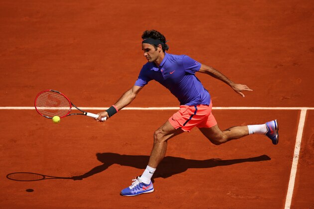 PARIS, FRANCE - MAY 27:  Roger Federer of Switzerland plays a forehand during his Men's Singles match against Marcel Granollers of Spain during day four of the 2015 French Open at Roland Garros on May 27, 2015 in Paris, France.  (Photo by Clive Mason/Getty Images)