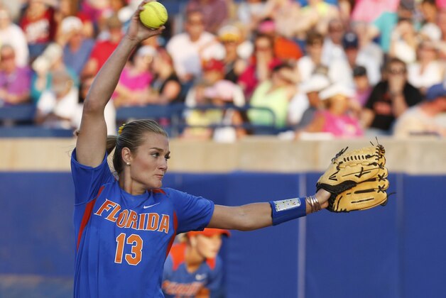 Florida pitcher Hannah Rogers delivers in the third inning of an NCAA women's college softball World Series tournament game against Alabama in Oklahoma City, Monday, June 2, 2014. (AP Photo/Sue Ogrocki)