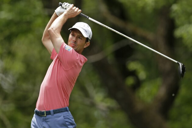 Mike Weir, of Canada, watches his tee shot on the 12th hole during the second round of the Wells Fargo Championship golf tournament in Charlotte, N.C., Friday, May 2, 2014. (AP Photo/Chuck Burton)
