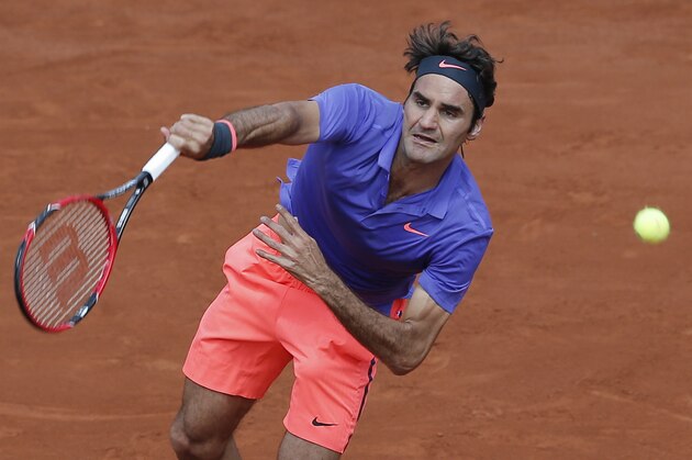 Switzerland's Roger Federer serves the ball to Spain's Marcel Granollers during their second round match of the French Open tennis tournament at the Roland Garros stadium, Wednesday, May 27, 2015 in Paris,  (AP Photo/Christophe Ena)
