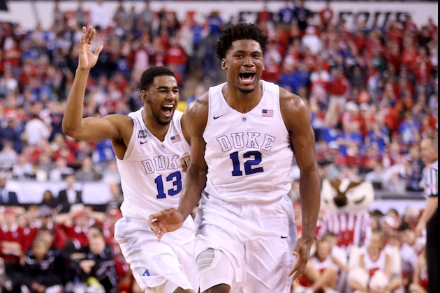 INDIANAPOLIS, IN - APRIL 06: Matt Jones #13 and Justise Winslow #12 of the Duke Blue Devils celebrate after defeating the Wisconsin Badgers during the NCAA Men's Final Four National Championship at Lucas Oil Stadium on April 6, 2015 in Indianapolis, Indiana. Duke defeated Wisconsin 68-63. (Photo by Andy Lyons/Getty Images)