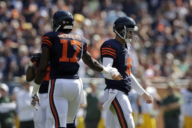 Chicago Bears quarterback Jay Cutler (6) shakes hands with wide receiver Alshon Jeffery (17) in the first half of an NFL football game against the Green Bay Packers Sunday, Sept. 28, 2014, in Chicago. (AP Photo/Nam Y. Huh)