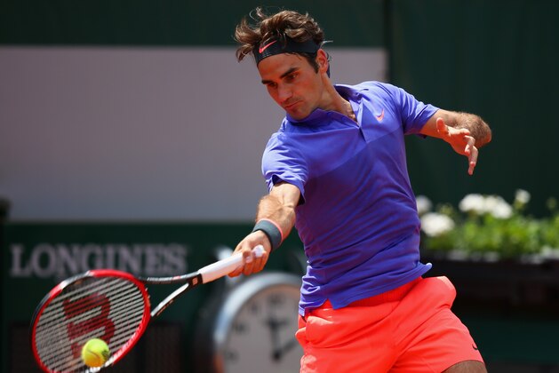 PARIS, FRANCE - MAY 27:  Roger Federer of Switzerland plays a forehand in his Men's Singles match against Marcel Granollers of Spain during day four of the 2015 French Open at Roland Garros on May 27, 2015 in Paris, France.  (Photo by Clive Mason/Getty Images)