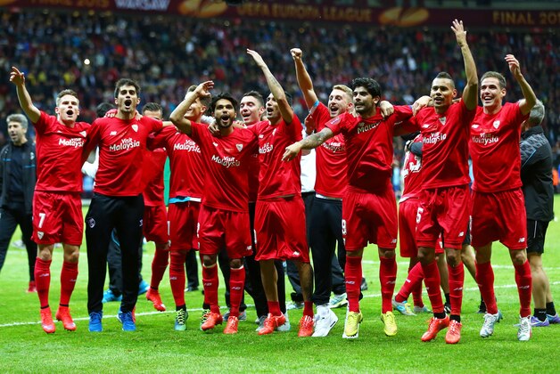 WARSAW, POLAND - MAY 27:  Sevilla players celebrate victory after the UEFA Europa League Final match between FC Dnipro Dnipropetrovsk and FC Sevilla on May 27, 2015 in Warsaw, Poland.  (Photo by Michael Steele/Getty Images)