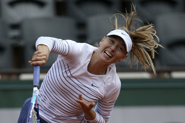 Russia's Maria Sharapova serves the ball to compatriot Vitalia Diatchenko during their second round match of the French Open tennis tournament at the Roland Garros stadium, Wednesday, May 27, 2015 in Paris,  (AP Photo/David Vincent)