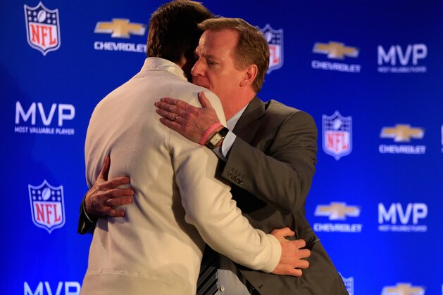 PHOENIX, AZ - FEBRUARY 02:  (L-R) Tom Brady of the New England Patriots hugs NFL Commissioner Roger Goodell during a Chevrolet Super Bowl XLIX MVP press conference folowing the Patriots Super Bowl win over the Seattle Seahawks on February 2, 2015 in Phoenix, Arizona.  (Photo by Jamie Squire/Getty Images)