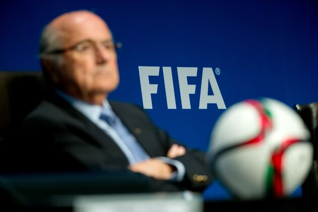 ZURICH, SWITZERLAND - MARCH 20: A FIFA logo sits on a wall behind FIFA President Joseph S. Blatter during a press conference at the end of the FIFA Executive Comitee meeting at the FIFA headquarters on March 20, 2015 in Zurich, Switzerland. (Photo by Philipp Schmidli/Getty Images)
