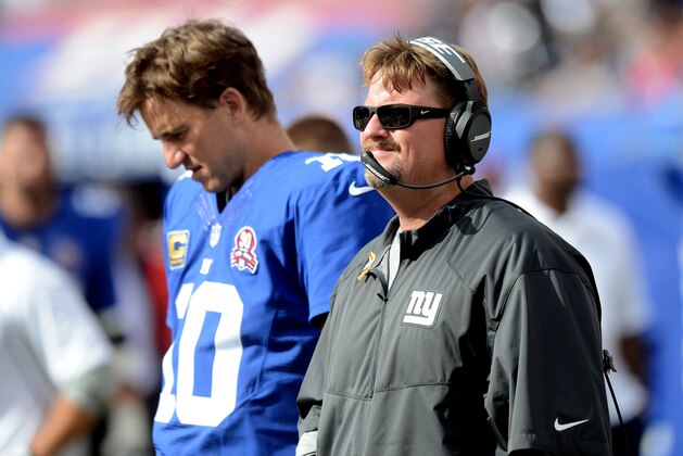 EAST RUTHERFORD, NJ - SEPTEMBER 14:  Offensive coordinator Ben McAdoo and quarterback Eli Manning #10 of the New York Giants look on from the sideline against the Arizona Cardinals during a game at MetLife Stadium on September 14, 2014 in East Rutherford, New Jersey.  (Photo by Ron Antonelli/Getty Images)