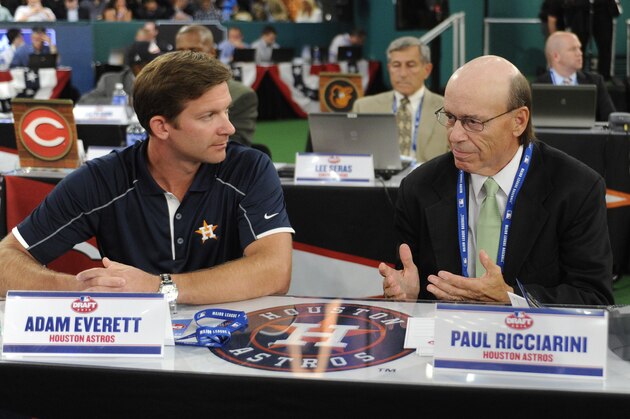 Houston Astros representatives Adam Everett, left, and Paul Ricciarini discuss who they are going to draft with the first pick in the 2014 MLB baseball draft Thursday, June 5, 2014, in Secaucus, N.J. The Astros chose Brady Aiken from San Diego, California. (AP Photo/Bill Kostroun)