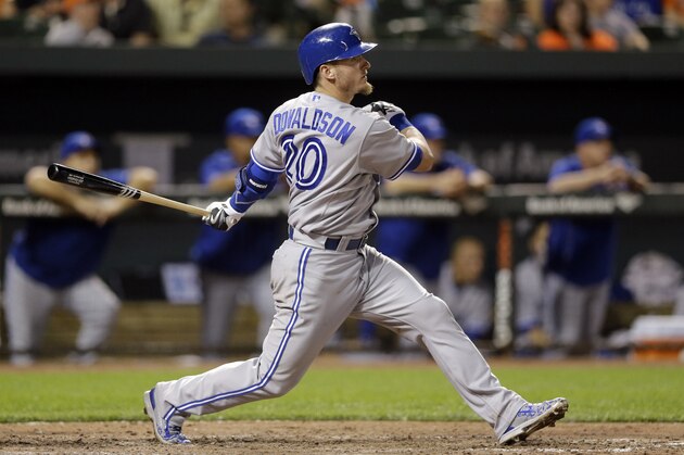 Toronto Blue Jays' Josh Donaldson watches his single during the seventh inning of a baseball game against the Baltimore Orioles, Tuesday, May 12, 2015, in Baltimore. Devon Travis scored on the play. Toronto won 10-2. (AP Photo/Patrick Semansky)