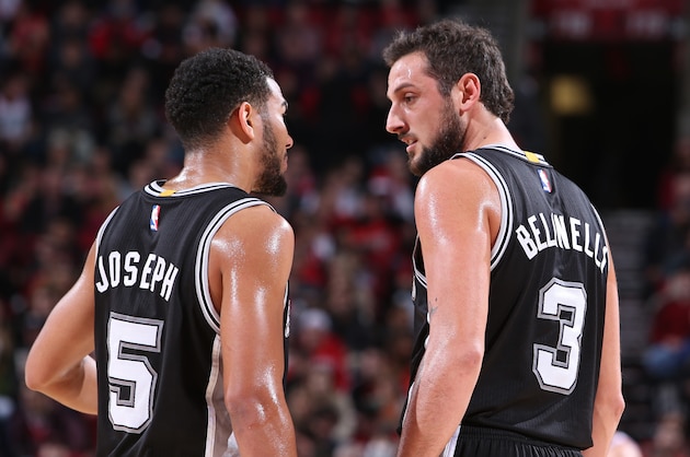 PORTLAND, OR - DECEMBER 15:  Cory Joseph #5 and Marco Belinelli #3 of the San Antonio Spurs talk against the Portland Trail Blazers on December 15, 2014 at the Moda Center Arena in Portland, Oregon. NOTE TO USER: User expressly acknowledges and agrees that, by downloading and or using this photograph, user is consenting to the terms and conditions of the Getty Images License Agreement. Mandatory Copyright Notice: Copyright 2014 NBAE (Photo by Sam Forencich/NBAE via Getty Images)