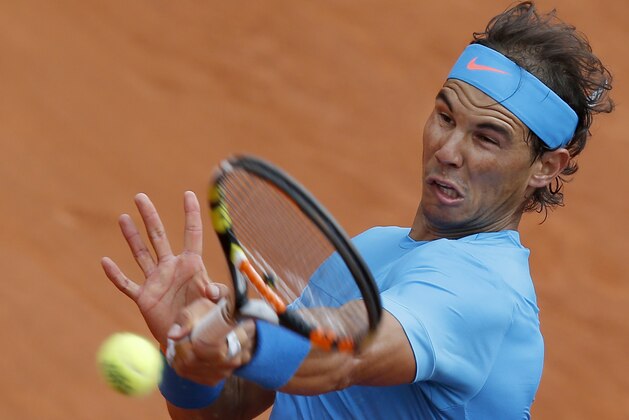 Spain's Rafael Nadal returns in the first round match of the French Open tennis tournament against Quentin Halys of France at the Roland Garros stadium, in Paris, France, Tuesday, May 26, 2015. Nadal won in three sets 6-3, 6-3, 6-4. (AP Photo/Michel Euler)
