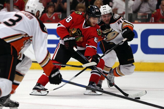 CHICAGO, IL - MAY 27:  Patrick Kane #88 of the Chicago Blackhawks skates to the net in the second period as Sami Vatanen #45 and Clayton Stoner #3 of the Anaheim Ducks defend in Game Six of the Western Conference Finals during the 2015 NHL Stanley Cup Playoffs at the United Center on May 27, 2015 in Chicago, Illinois.  (Photo by Jonathan Daniel/Getty Images)