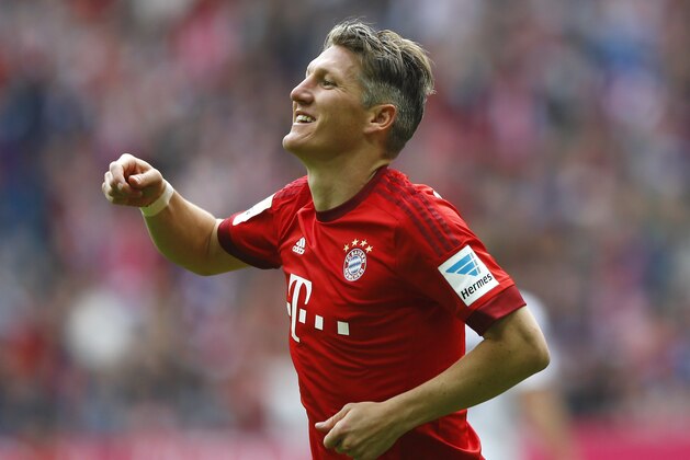 Bayern's Bastian Schweinsteiger celebrates after scoring his side's second goal during the German first division Bundesliga soccer match between FC Bayern Munich and 1. FSV Mainz 05 at the Allianz Arena in Munich, Germany, on Saturday, May 23, 2015. (AP Photo/Matthias Schrader)