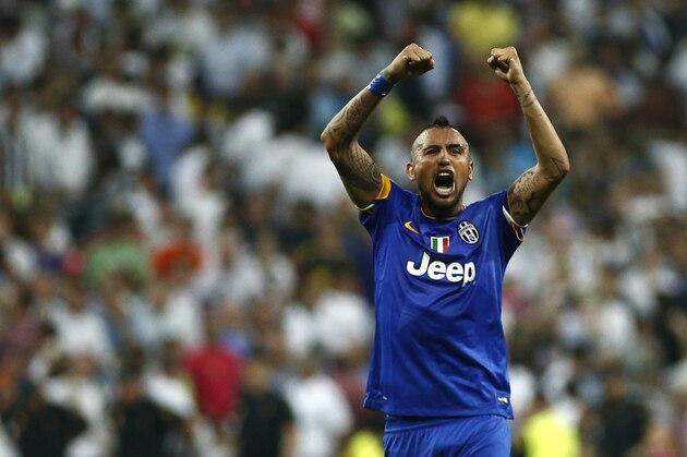 FILE - In this May 13, 2015, file photo, Juventus' Arturo Vidal, from Chile, celebrates after wining the Champions League second leg semifinal soccer match between Real Madrid and Juventus, at the Santiago Bernabeu stadium in Madrid. Vidal will play with the Chile national soccer team in the upcoming 2015 Copa America. (AP Photo/Oscar del Pozo, File)