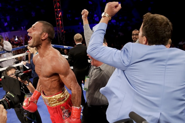 Kell Brook, left, celebrates his win over Shawn Porter in the IBF welterweight title boxing bout Saturday, Aug. 16, 2014, in Carson, Calif. (AP Photo/Chris Carlson)
