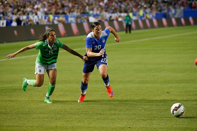 LOS ANGELES, CA - MAY 17:  Forward Abby Wambach #20 of USA and Defender Bianca Sierra #15 of Mexico chase after a ball in the second half during their international friendly match at StubHub Center on May 17, 2015 in Los Angeles, California.  (Photo by Joe Scarnici/Getty Images)