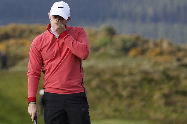 Northern Ireland's Rory McIlroy reacts after missing a putt on hole 11 during round one of the Irish Open Golf Championship at Royal County Down, Newcastle, Northern Ireland, Thursday, May 28, 2015.  (AP Photo/Peter Morrison)