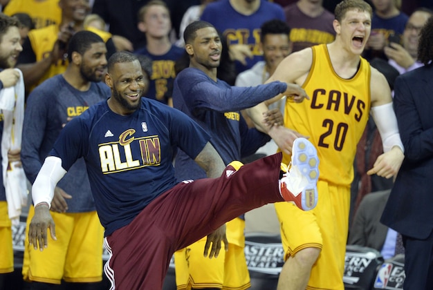 May 26, 2015; Cleveland, OH, USA; Cleveland Cavaliers forward LeBron James (23) reacts on the bench during the fourth quarter against the Atlanta Hawks in game four of the Eastern Conference Finals of the NBA Playoffs at Quicken Loans Arena. Mandatory Credit: David Richard-USA TODAY Sports