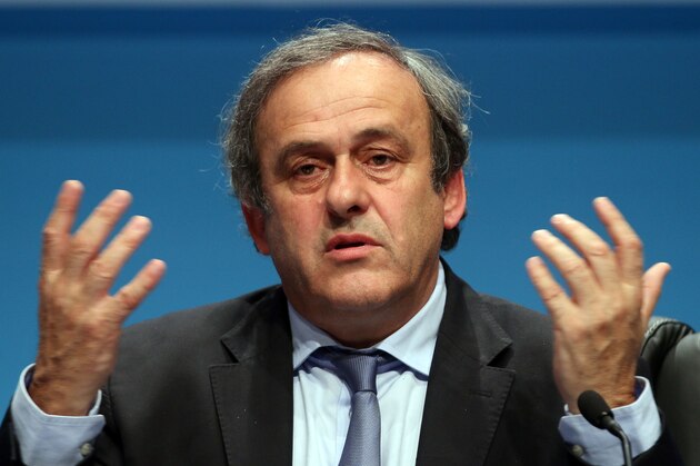 UEFA President Michel Platini laughs during a news conference at the end of the 39th Ordinary UEFA Congress in Vienna, Austria, Tuesday, March 24, 2015. Platini was re-elected as UEFA president for a third four-year term. He was unopposed to extend his presidential reign, which started in 2007, and was acclaimed by the leaders of UEFA's 54 member federations.(AP Photo/Ronald Zak)