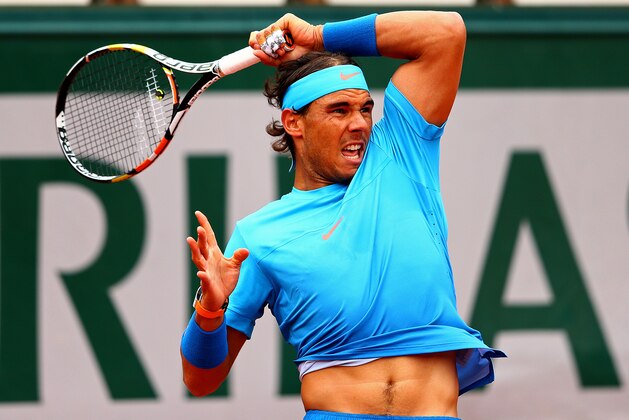 PARIS, FRANCE - MAY 28:  Rafael Nadal of Spain returns a shot during his Men's Singles match against Nicolas Almagro of Spain on day five of the 2015 French Open at Roland Garros on May 28, 2015 in Paris, France.  (Photo by Clive Mason/Getty Images)