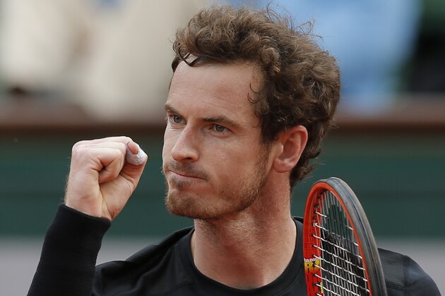 Britain's Andy Murray clenches his fist after scoring a point in the second round match of the French Open tennis tournament against Portugal's Joao Sousa at the Roland Garros stadium, in Paris, France, Thursday, May 28, 2015.  (AP Photo/Christophe Ena)