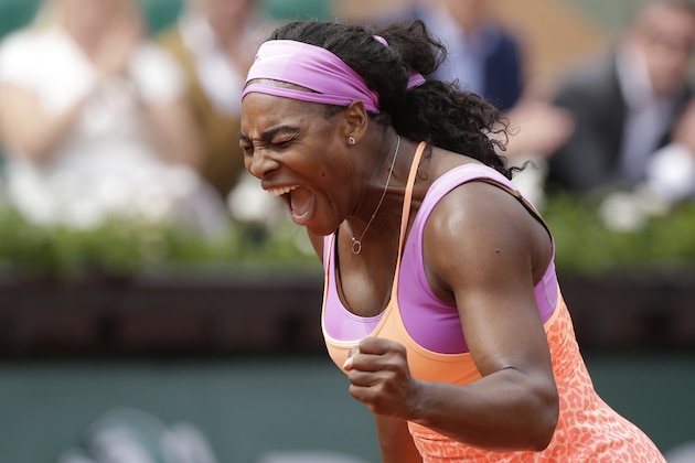 Serena Williams of the U.S. celebrates winning the second round match of the French Open tennis tournament against Germany's Anna-Lena Friedsam in three sets 5-7, 6-3, 6-3, at the Roland Garros stadium, in Paris, France, Thursday, May 28, 2015. (AP Photo/Thibault Camus)