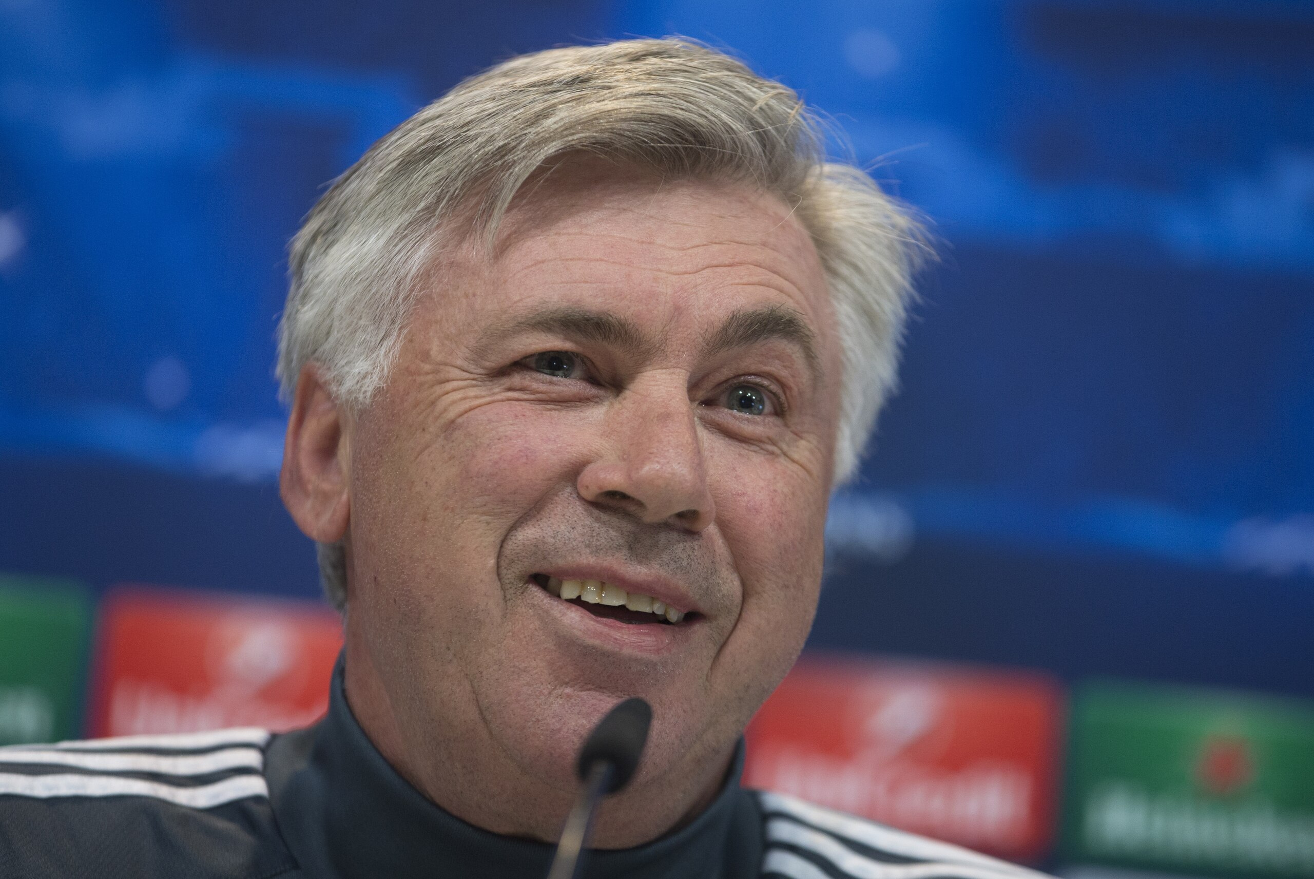 Real Madrid's coach Carlo Ancelotti smiles during a press conference in Madrid, Spain Tuesday April 21, 2015. Real Madrid will play Atletico Madrid Wednesday in a Champions League quarterfinal second leg soccer match in Madrid.(AP Photo/Paul White)