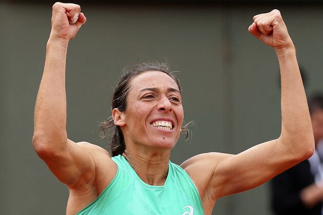 Italy's Francesca Schiavone celebrates after defeating Russia's Svetlana Kuznetsova after  their second round match of the French Open tennis tournament at the Roland Garros stadium, Thursday, May 28, 2015 in Paris. Schiavone won 6-7, 7-5, 10-8 in 3 hours and 50 minutes. (AP Photo/David Vincent)